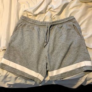 Grey sweat shorts, medium but go to about mid thigh